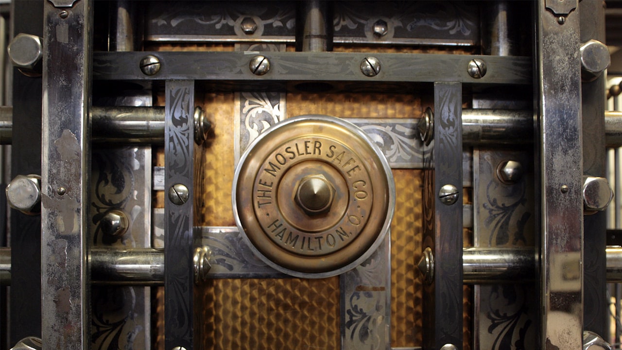 a close up of a metal door with a lock