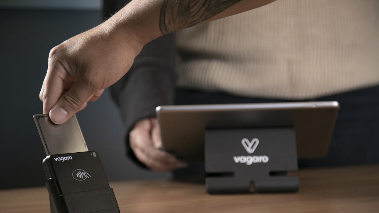 a person holding a tablet in their hand