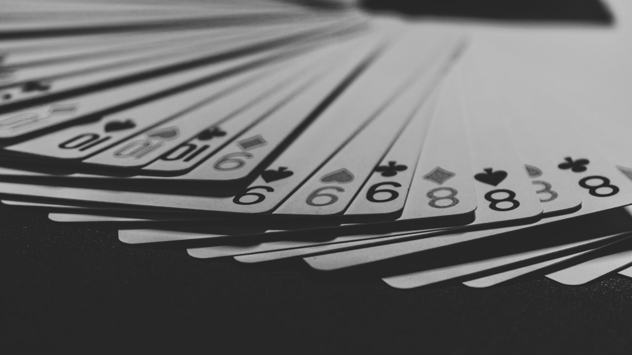 grayscale photo of a fanned playing card
