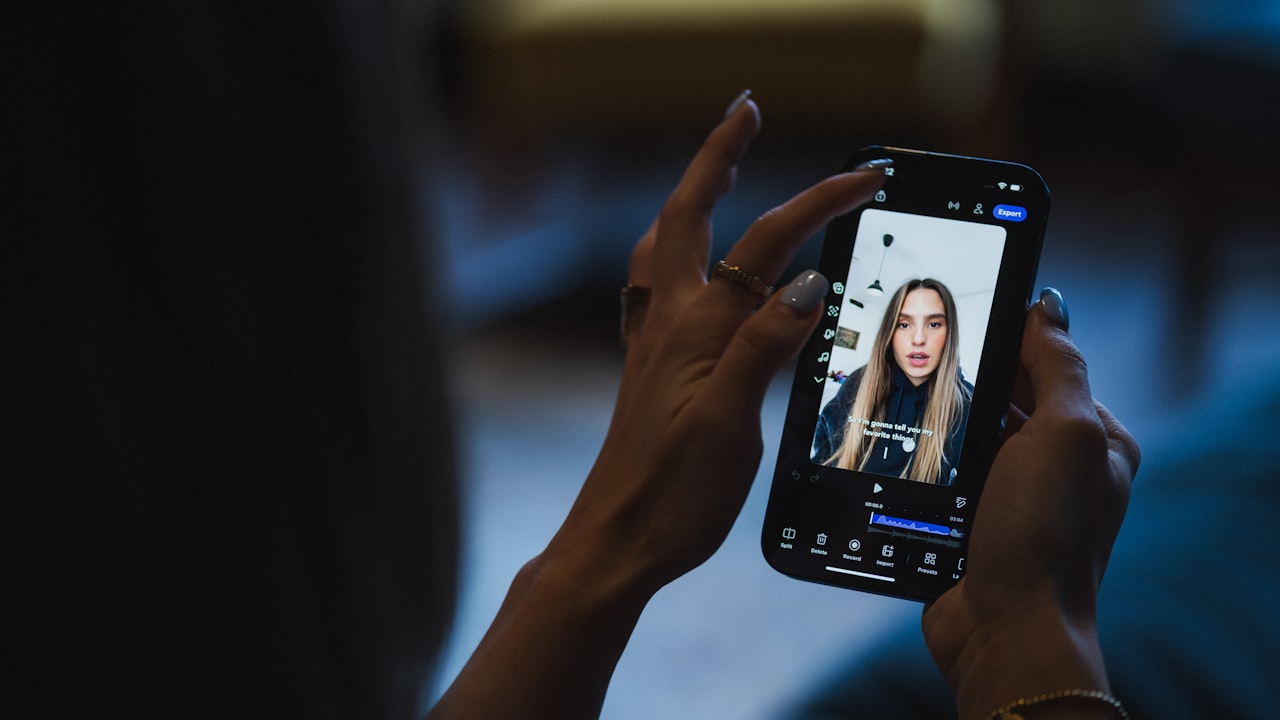 Person watching video on smartphone screen of smartphone