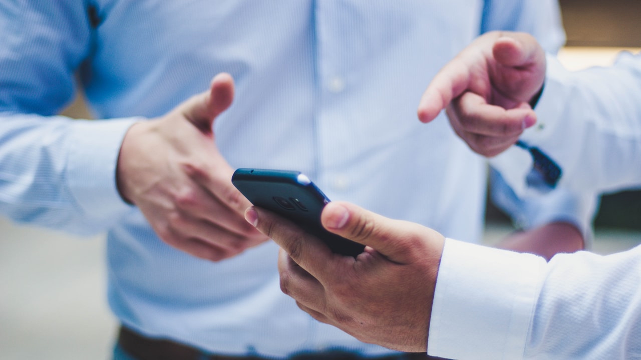 person holding black smartphone