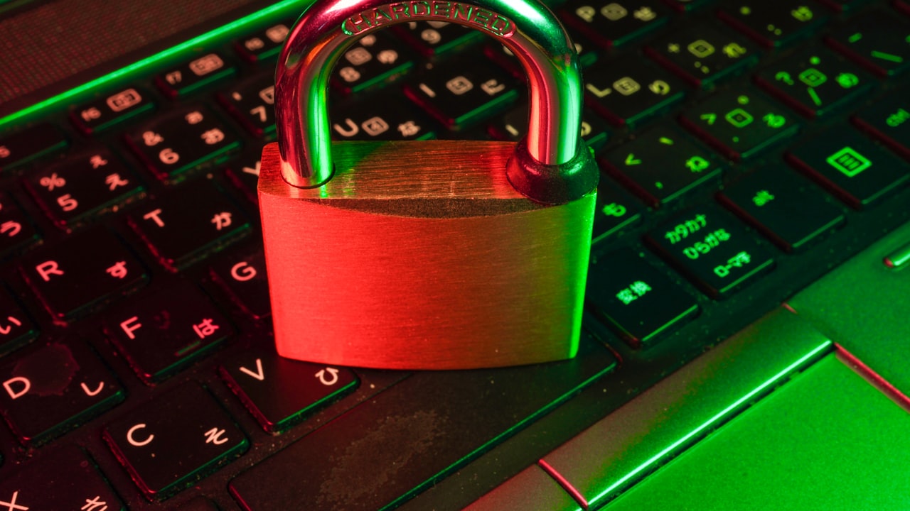 red padlock on black computer keyboard