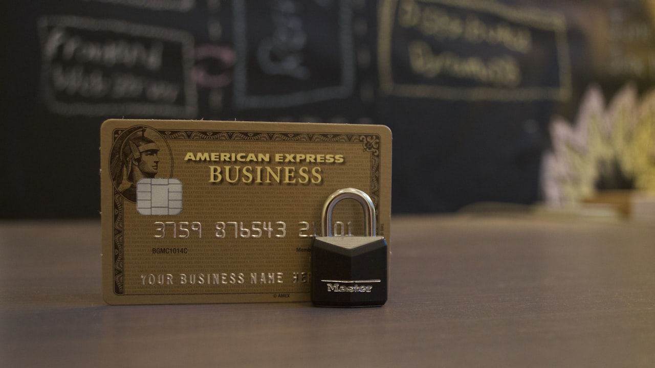 closeup photo of American Express Business card on brown surface