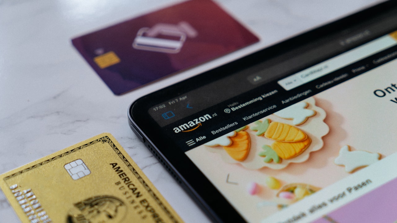 a smart phone sitting next to a credit card