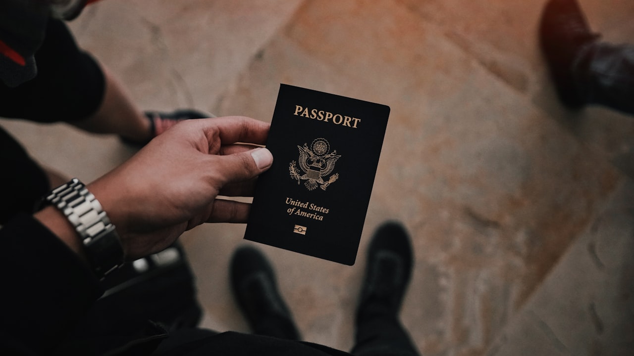 person holding passport